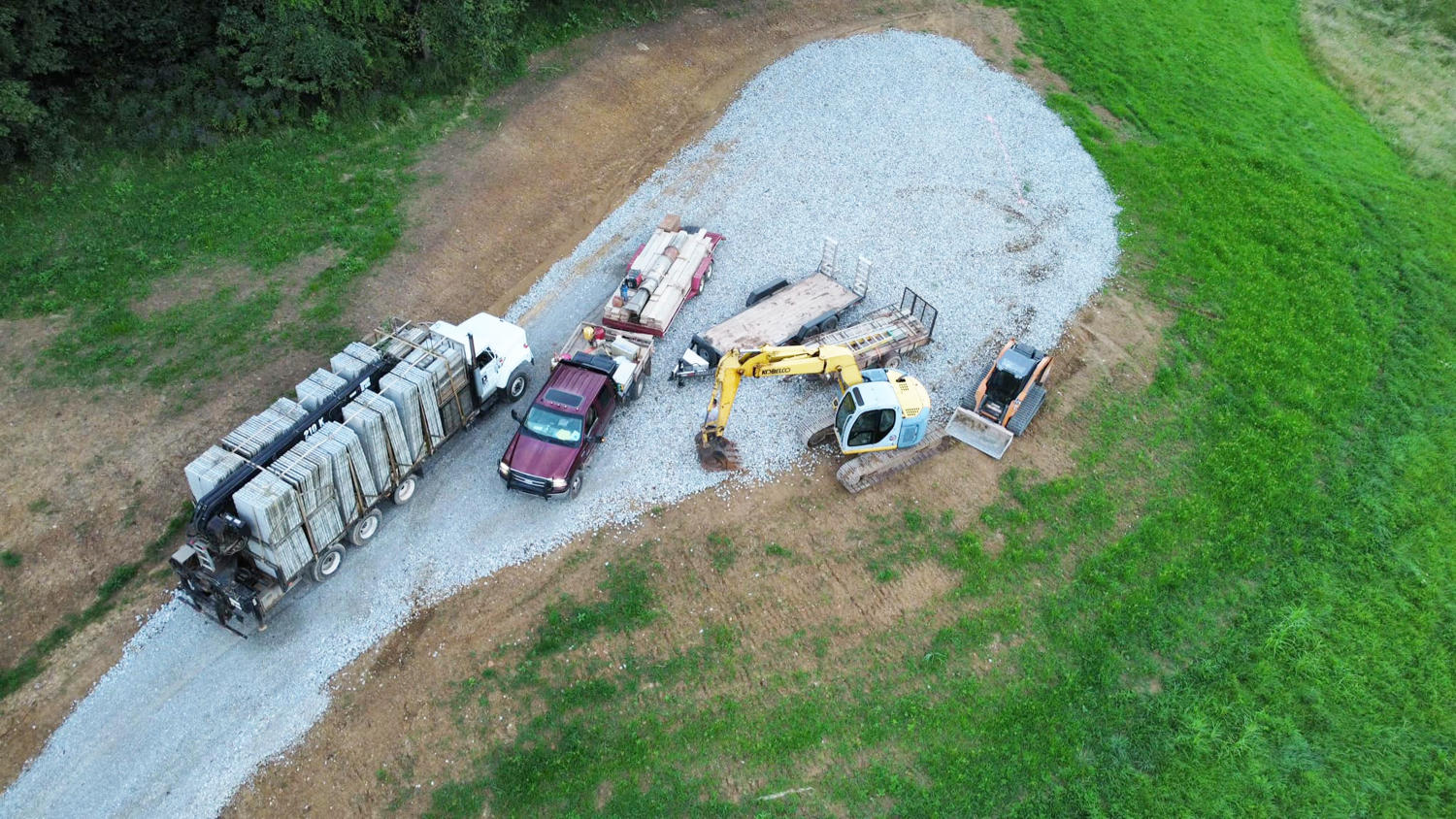 gravel driveway with construction equipment