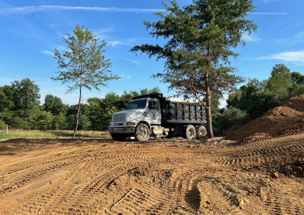 dump truck on new driveway construction